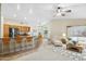 Spacious open floor plan featuring a kitchen island with bar seating, and bright natural light at 15758 W Edgemont Ave, Goodyear, AZ 85395
