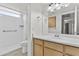Bathroom featuring light wood cabinets, shower, and tile floors at 3845 E Greenway Rd # 131, Phoenix, AZ 85032