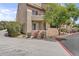 Charming condo exterior with front patio, flowering plants, and walkway access at 3845 E Greenway Rd # 131, Phoenix, AZ 85032