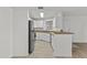 Bright kitchen featuring white cabinets, wood countertops, stainless steel appliances, and a tile backsplash at 3845 E Greenway Rd # 131, Phoenix, AZ 85032