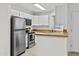 The kitchen featuring stainless steel appliances, wood countertops, and white cabinetry at 3845 E Greenway Rd # 131, Phoenix, AZ 85032