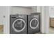 Laundry room featuring gray side-by-side washer and dryer at 3845 E Greenway Rd # 131, Phoenix, AZ 85032
