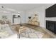 Cozy living room featuring a fireplace, open floor plan, and modern decor at 3845 E Greenway Rd # 131, Phoenix, AZ 85032