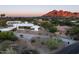 Aerial view of a modern home nestled in a desert landscape with mountain views at 6623 N Hillside Dr, Paradise Valley, AZ 85253