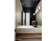 Contemporary bathroom featuring a marble countertop and a unique Buddha statue at 6623 N Hillside Dr, Paradise Valley, AZ 85253