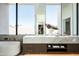 Elegant bathroom with marble countertops, a soaking tub, and bright natural light at 6623 N Hillside Dr, Paradise Valley, AZ 85253