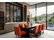 Elegant dining area featuring a modern table setting, a designer chandelier, and stunning views of the surrounding landscape at 6623 N Hillside Dr, Paradise Valley, AZ 85253