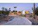 Modern home with desert landscaping, featuring a long driveway and a three car garage at 6623 N Hillside Dr, Paradise Valley, AZ 85253