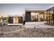Contemporary home with clean lines, a cozy outdoor fireplace, and desert-friendly landscaping at 6623 N Hillside Dr, Paradise Valley, AZ 85253