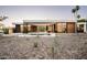 Stunning modern home featuring a sleek pool, spacious patio, and expansive glass windows at 6623 N Hillside Dr, Paradise Valley, AZ 85253