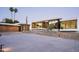 Striking modern home with clean lines, desert landscaping, and ample parking space at 6623 N Hillside Dr, Paradise Valley, AZ 85253