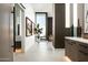 Hallway leading to a living room with large windows, complemented by modern decor at 6623 N Hillside Dr, Paradise Valley, AZ 85253
