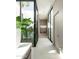 Bright hallway with floor-to-ceiling windows showcasing a private courtyard at 6623 N Hillside Dr, Paradise Valley, AZ 85253