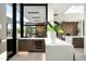 Modern kitchen with a bar counter and a beverage cooler, featuring large windows that bring in natural light at 6623 N Hillside Dr, Paradise Valley, AZ 85253