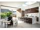 Bright, modern kitchen featuring an island, skylight, and seamless indoor-outdoor living at 6623 N Hillside Dr, Paradise Valley, AZ 85253