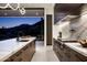 Stylish kitchen showcasing stainless steel appliances, quartz countertops, and scenic views through large picture windows at 6623 N Hillside Dr, Paradise Valley, AZ 85253