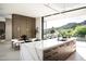 Bright, modern kitchen with a large island, sleek cabinets, and expansive windows showcasing beautiful mountain views at 6623 N Hillside Dr, Paradise Valley, AZ 85253