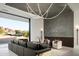Bright, open living space featuring a comfortable gray sofa and views of the landscape at 6623 N Hillside Dr, Paradise Valley, AZ 85253