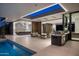 Open-concept living space featuring pool views, modern kitchen and cozy seating at 6623 N Hillside Dr, Paradise Valley, AZ 85253