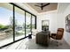 Bright office space featuring floor-to-ceiling windows, modern lighting, and elegant decor at 6623 N Hillside Dr, Paradise Valley, AZ 85253