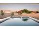 Serene pool view with a backdrop of mature landscaping and views of Camelback Mountain at 6623 N Hillside Dr, Paradise Valley, AZ 85253