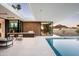 A refreshing pool area with an outdoor kitchen and cozy seating, perfect for entertaining at 6623 N Hillside Dr, Paradise Valley, AZ 85253