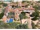 Large estate home with multiple buildings and a pool at 8000 E Mariposa Grande Dr, Scottsdale, AZ 85255