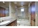 Bathroom with tile shower and granite countertop at 8000 E Mariposa Grande Dr, Scottsdale, AZ 85255