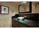 Bathroom with dark vanity and vessel sink at 8000 E Mariposa Grande Dr, Scottsdale, AZ 85255