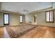 Spacious bedroom with hardwood floors, plantation shutters, and a large area rug at 8000 E Mariposa Grande Dr, Scottsdale, AZ 85255