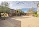 Paved courtyard with stone buildings and landscaping at 8000 E Mariposa Grande Dr, Scottsdale, AZ 85255