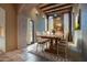 Rustic dining room features a wood table with chairs and brick accents at 8000 E Mariposa Grande Dr, Scottsdale, AZ 85255