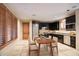 Modern kitchen with dark wood cabinets and stainless steel appliances at 8000 E Mariposa Grande Dr, Scottsdale, AZ 85255