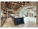 Open kitchen with large island and views to living area at 8000 E Mariposa Grande Dr, Scottsdale, AZ 85255