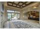 Open living room with kitchen and pool view at 8000 E Mariposa Grande Dr, Scottsdale, AZ 85255