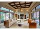 Bright living room with fireplace and large windows at 8000 E Mariposa Grande Dr, Scottsdale, AZ 85255