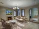 Elegant living room featuring a fireplace and comfortable seating at 8000 E Mariposa Grande Dr, Scottsdale, AZ 85255