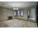 Elegant living room with fireplace and chandelier at 8000 E Mariposa Grande Dr, Scottsdale, AZ 85255