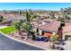 Luxury home with tile roof, palm trees, and mountain views at 23228 N Gaviota Dr, Sun City West, AZ 85375