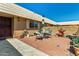 Charming brick patio with a bistro table and chairs at 10814 W Cameo Dr, Sun City, AZ 85351