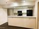Well-equipped kitchen, includes black appliances and white cabinets at 1920 W Lindner Ave # 137, Mesa, AZ 85202