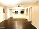 Bright living room with dark brown tile floors and ceiling fan at 1920 W Lindner Ave # 137, Mesa, AZ 85202