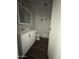 Bathroom featuring a bright white vanity and tub with a window, and a medicine cabinet above the sink at 245 S 56Th St # 209, Mesa, AZ 85206