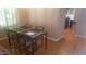 Bright dining area with modern table set near shuttered windows and hardwood floors at 15626 N 50Th St, Scottsdale, AZ 85254