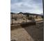 Unfinished backyard with block and wrought iron fence and desert landscape and mountain views at 5678 N 205Th Ln, Buckeye, AZ 85396