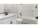 Bathroom featuring a modern vanity, toilet, and a shower-tub combination at 5678 N 205Th Ln, Buckeye, AZ 85396