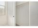 Bright closet interior with a rod for hanging clothes and white walls at 5678 N 205Th Ln, Buckeye, AZ 85396