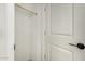 Spacious walk-in closet with rod and shelf, next to a white door with black hardware at 5678 N 205Th Ln, Buckeye, AZ 85396