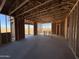 Interior framing of a room with large windows and a view of the desert during construction at 47748 W Moeller Rd, Maricopa, AZ 85139