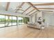 Light-filled living room featuring hardwood floors, a fireplace, and sliding doors to patio at 8403 E Nightingale Star Dr, Scottsdale, AZ 85266